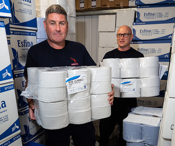 Stephen and team with paper products